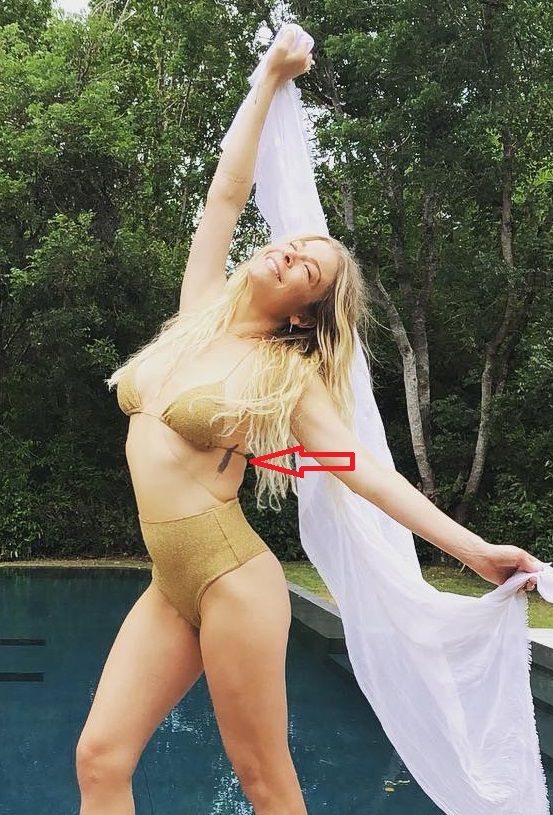 LeAnn Rimes feather ribcage tattoo