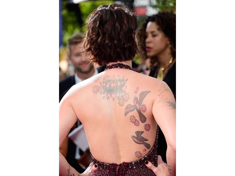 Lena Headey swallow and lotus back tattoo
