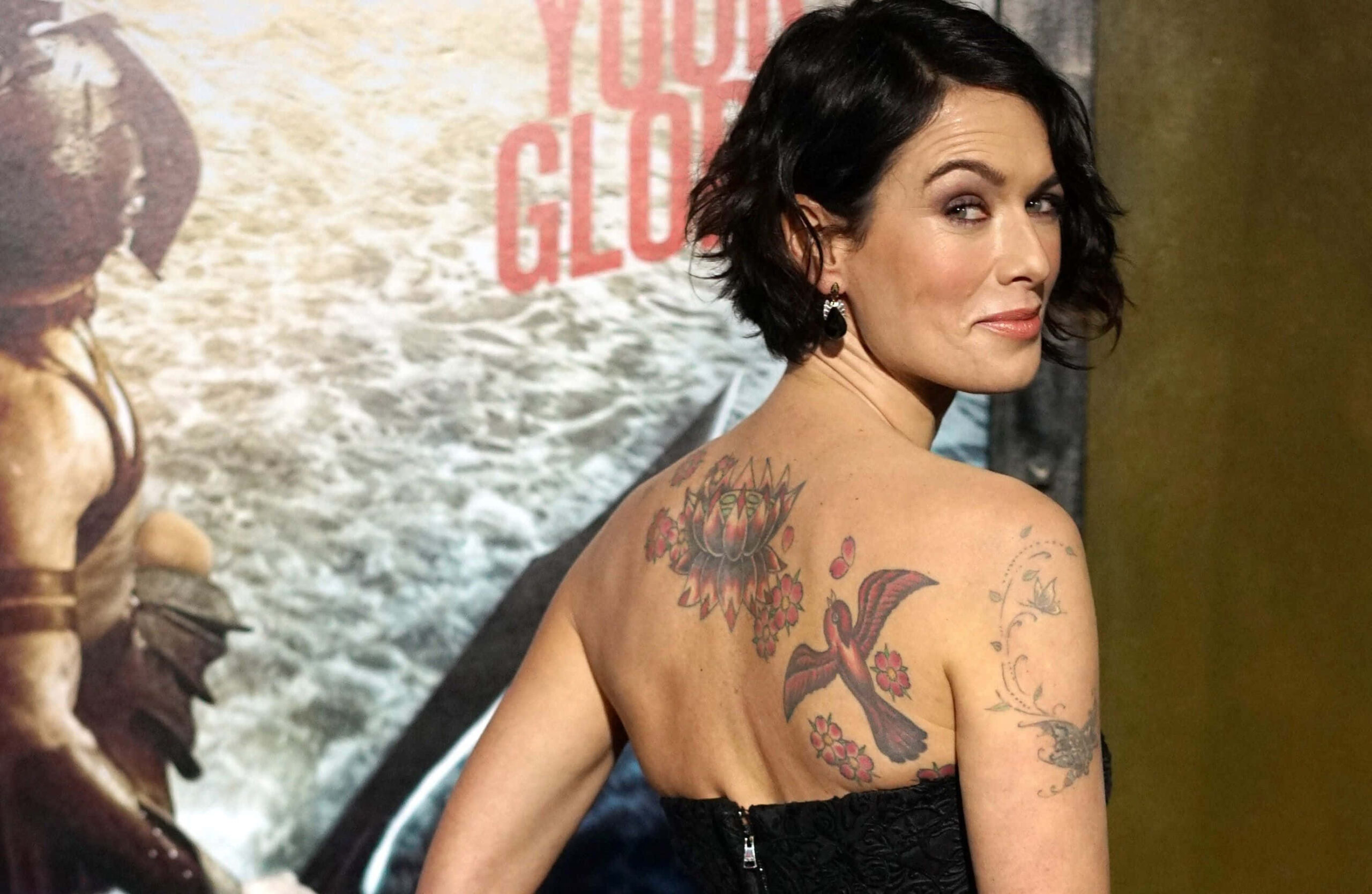Lena Headey large back lotus bird tattoos