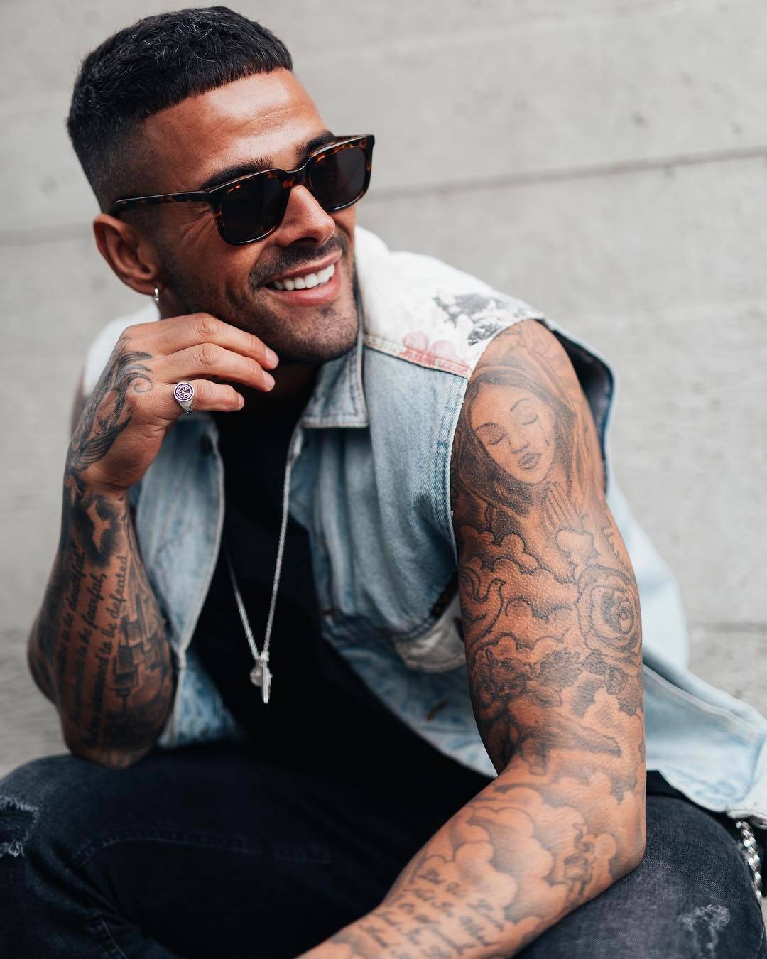 Leon Scott woman portrait bird left arm Leon Scott tattoos: The woman’s portrait, bird and clouds on his left arm