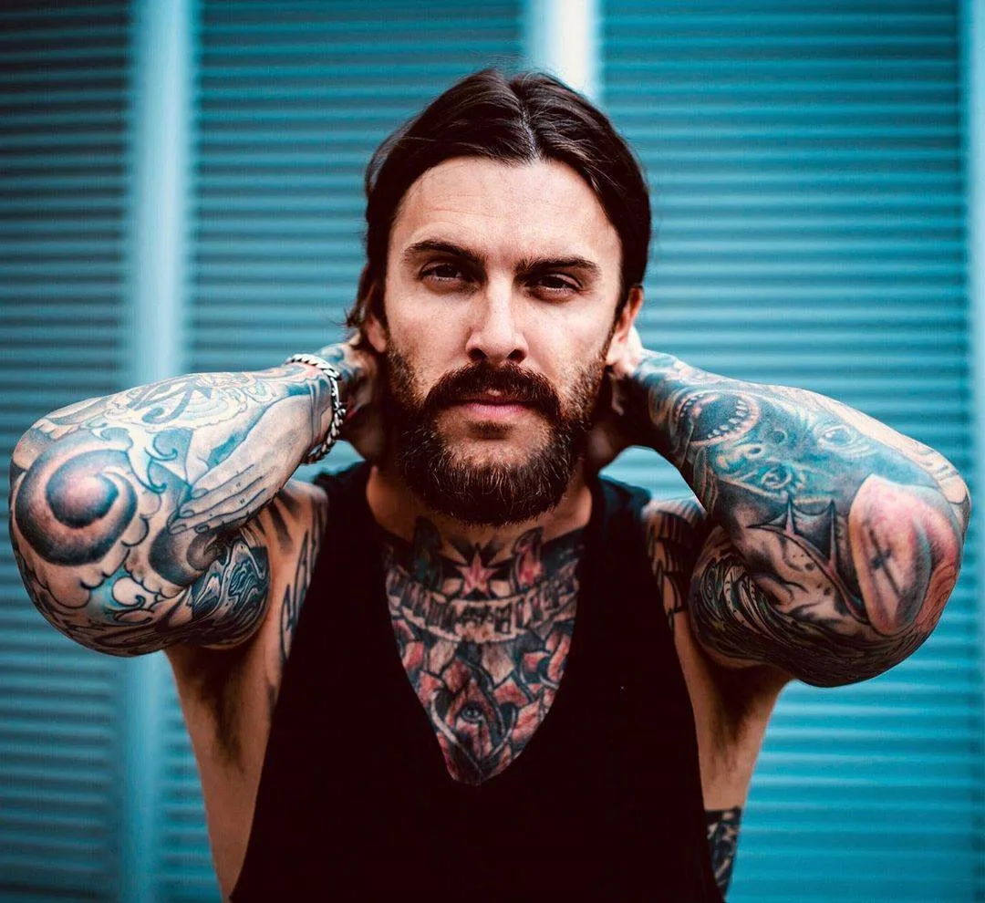 Levi Stocke tattoos: The bold eye and heart tattoos at his elbows