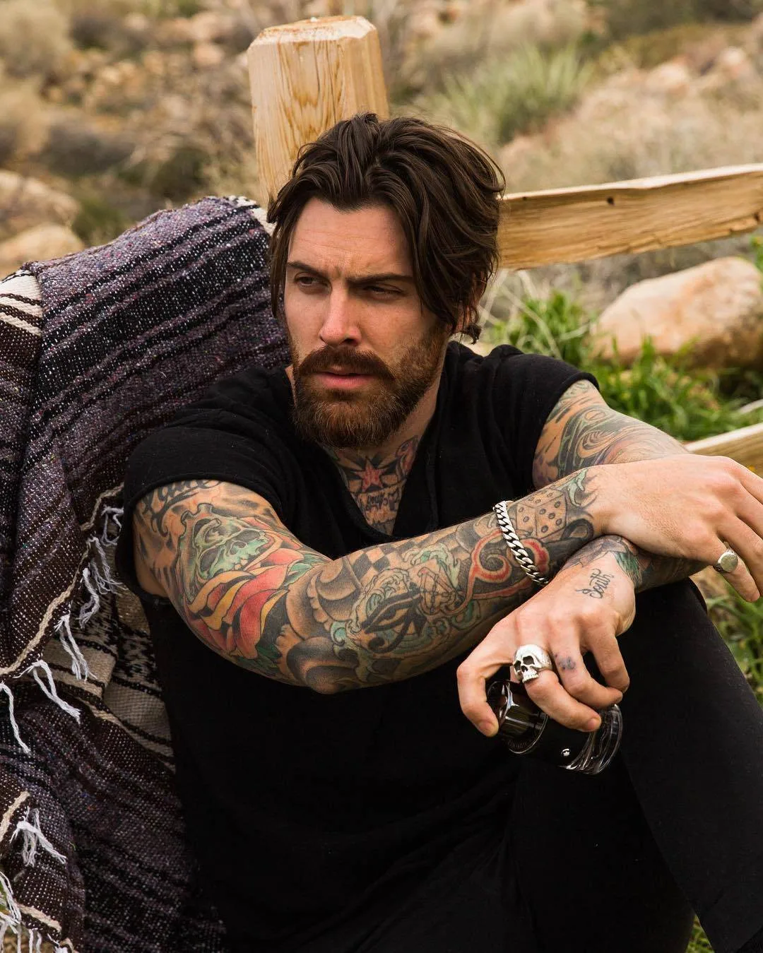 Levi Stocke tattoos: The framed eye and dice on his forearm