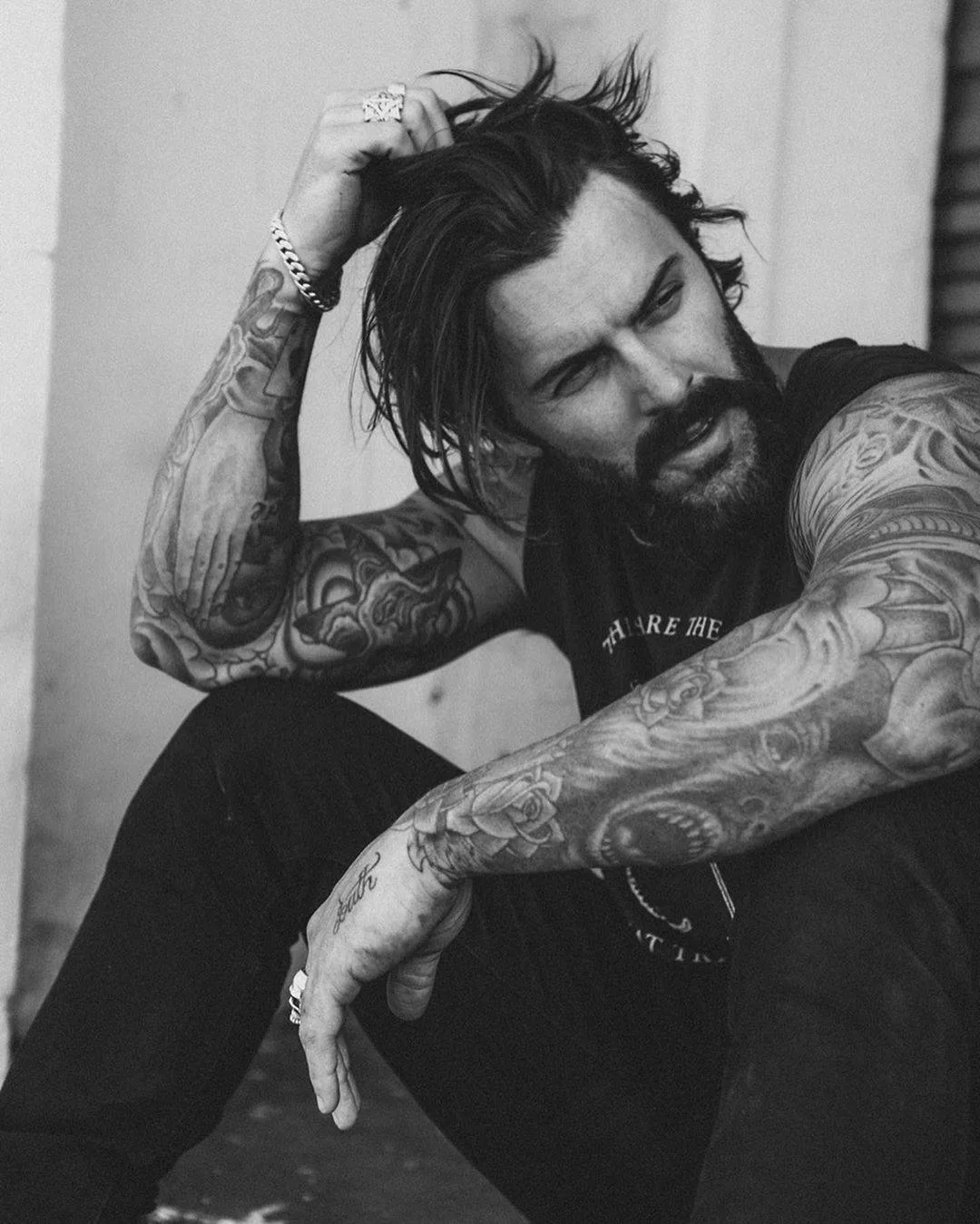 Levi Stocke tattoos: The inner-arm hand design and wrist flower