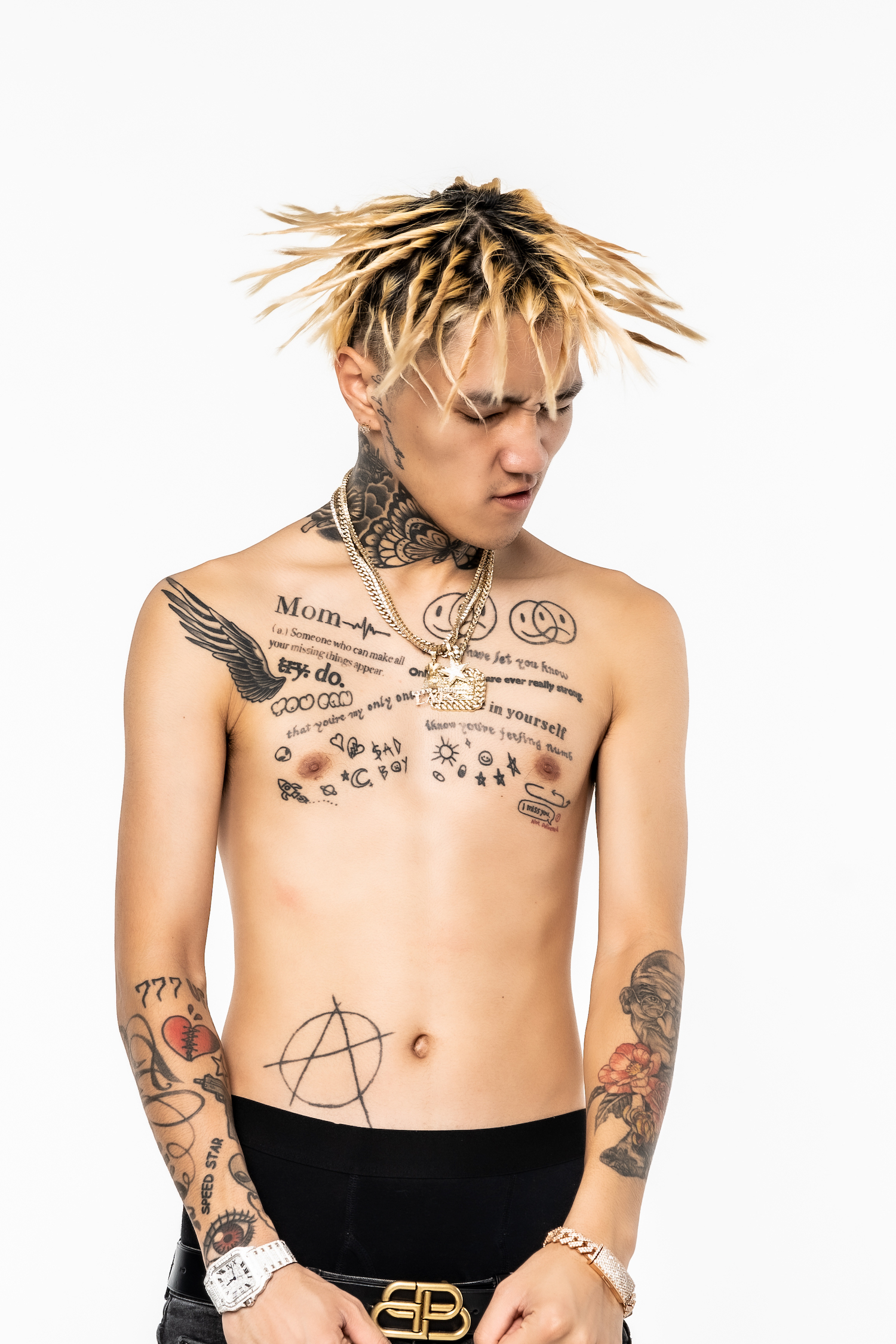 LEX LEX's forearm and arm tattoos in a distinct studio portrait, illustrating the visible collection around the Anakin and Gandhi discussion LEX tattoos: LEX's forearm and arm tattoos in a distinct studio portrait, illustrating the visible collection around the Anakin and Gandhi discussion