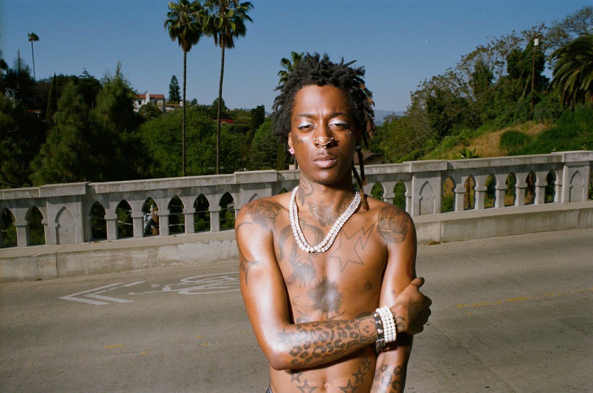 Lil Nas X tattoos: stars and darker arm tattoos