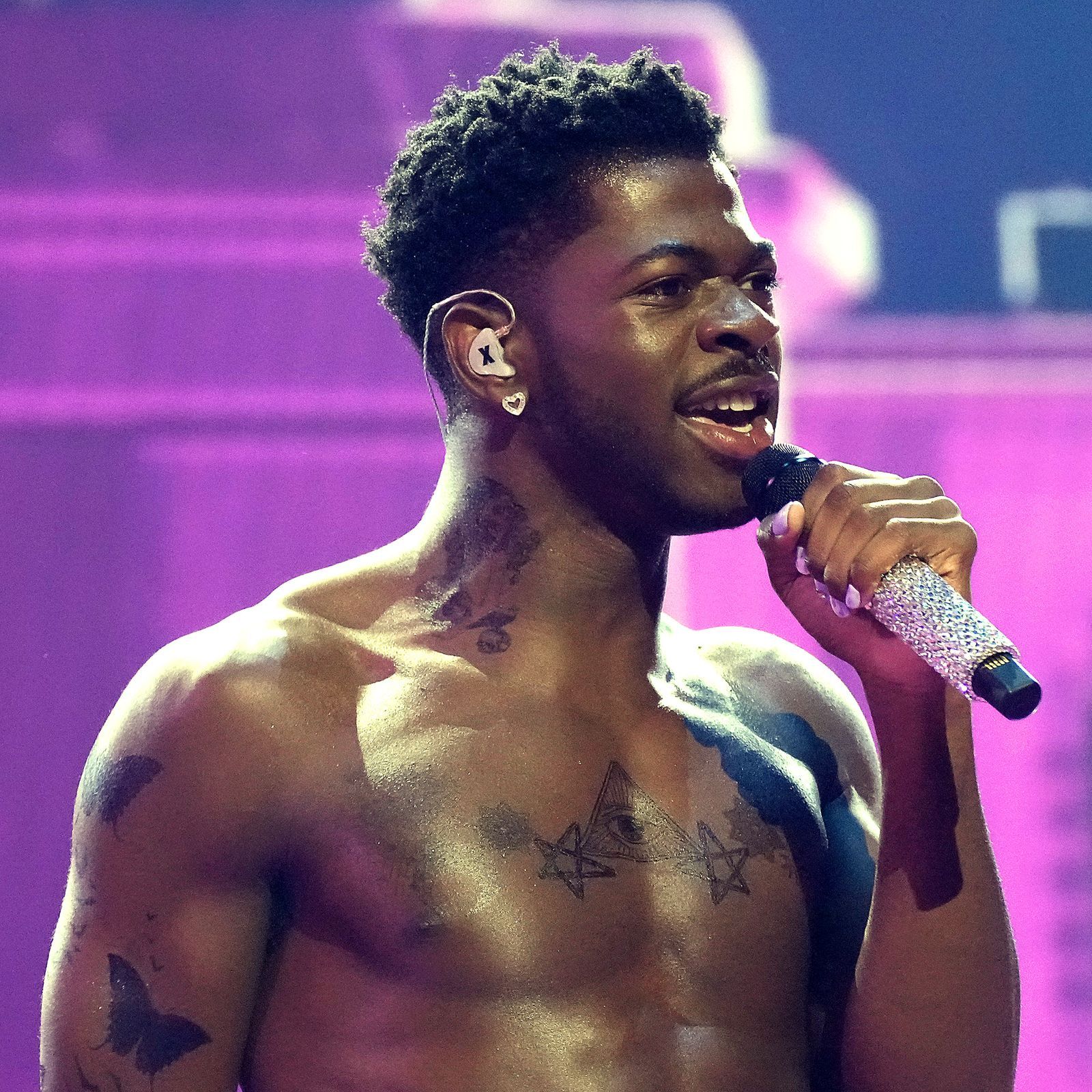 Lil Nas X tattoos: all-seeing eye chest tattoo