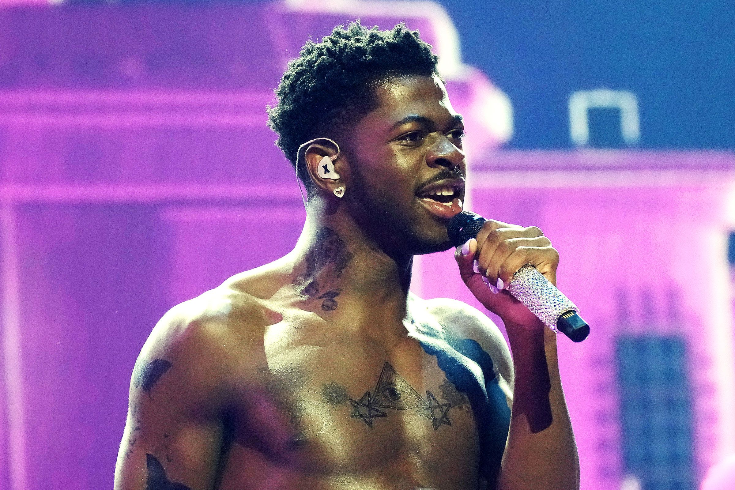 Lil Nas X tattoos: chest and neck tattoo overview