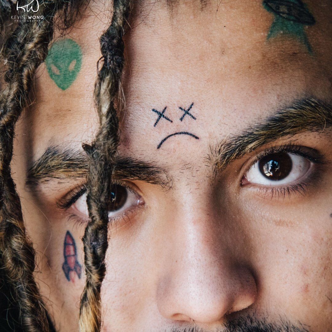 Lil Pump alien and rocket face tattoos