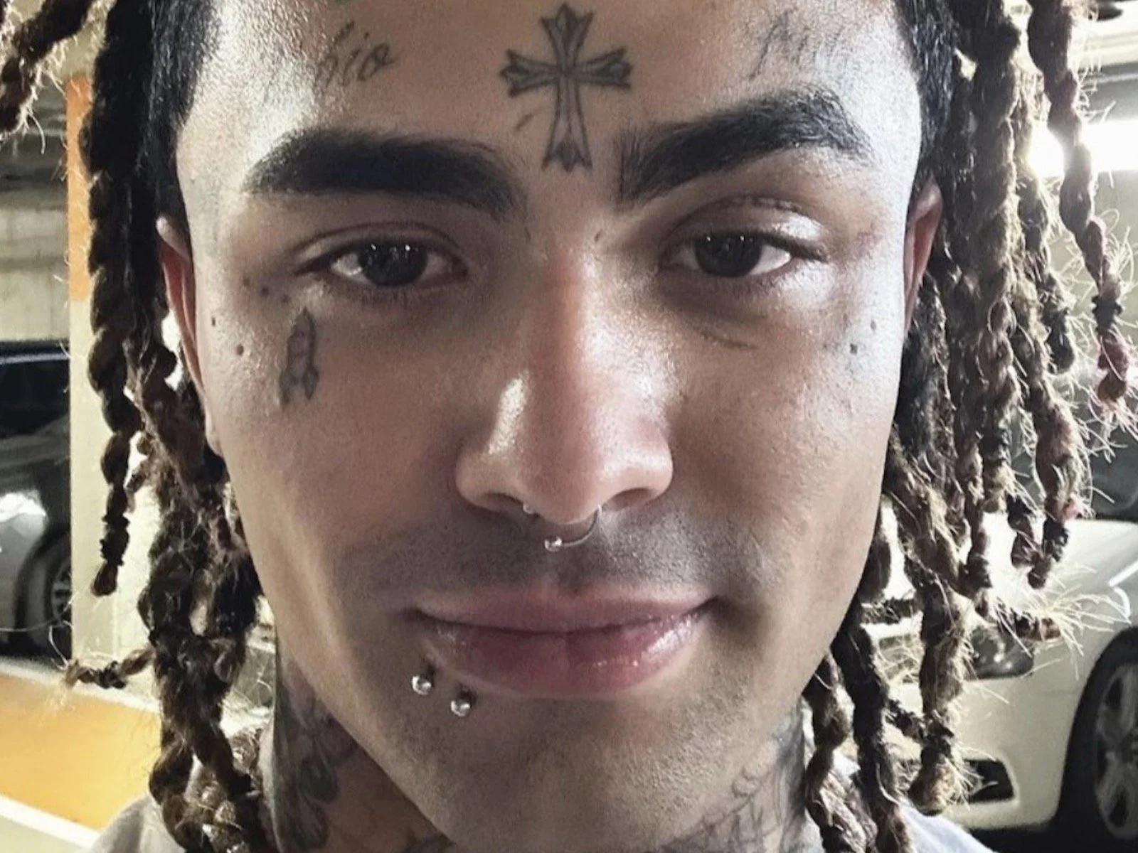 Lil Pump forehead cross and face tattoos