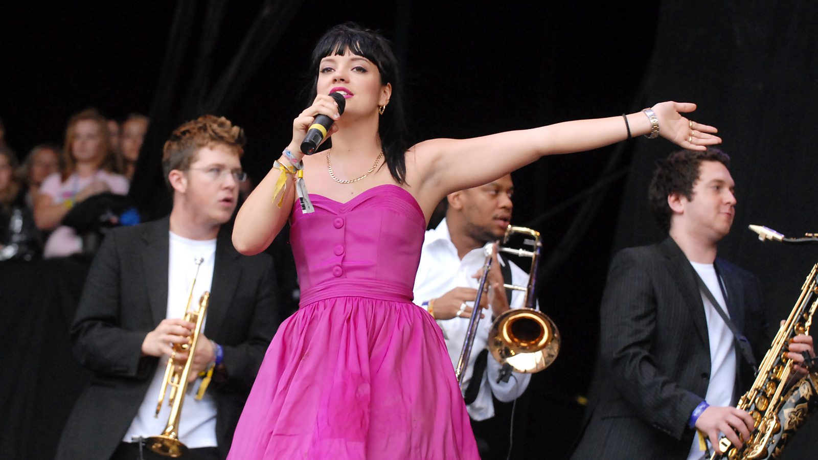 Lily Allen in a contextual photograph: contextual live-performance photograph, not tattoo evidence; not tattoo evidence