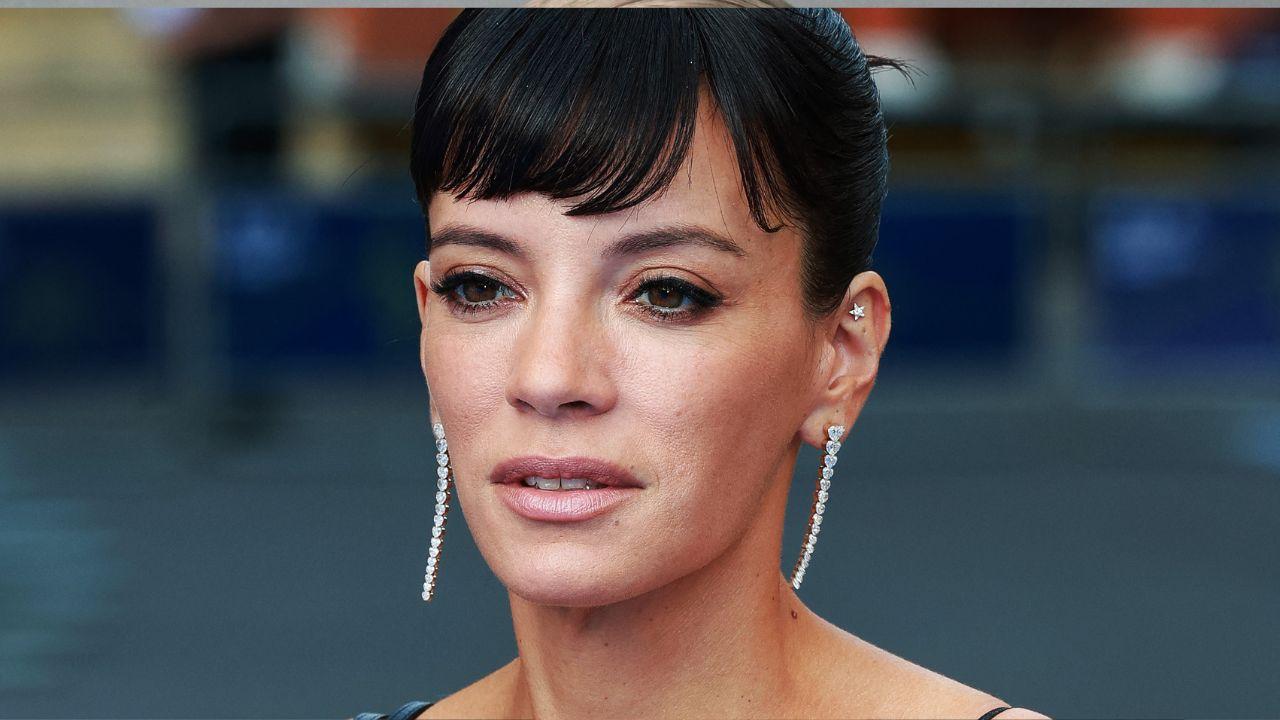 Lily Allen in a contextual photograph: contextual press-event face photograph, not tattoo evidence; not tattoo evidence