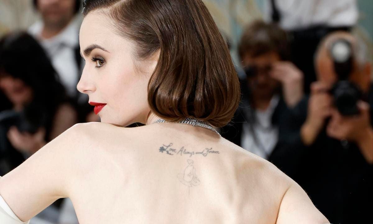Lily Collins tattoos: Peter Pan figure tattoo on the upper back