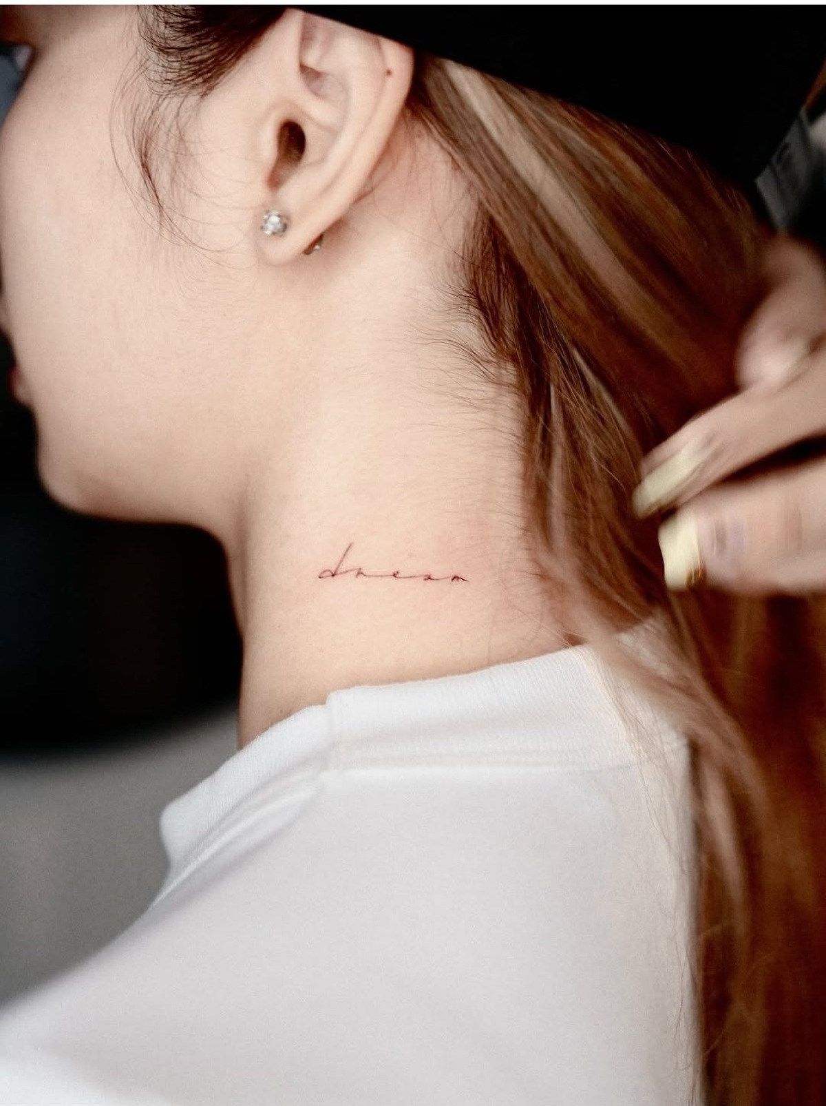 Lisa tattoos: neck lettering close-up