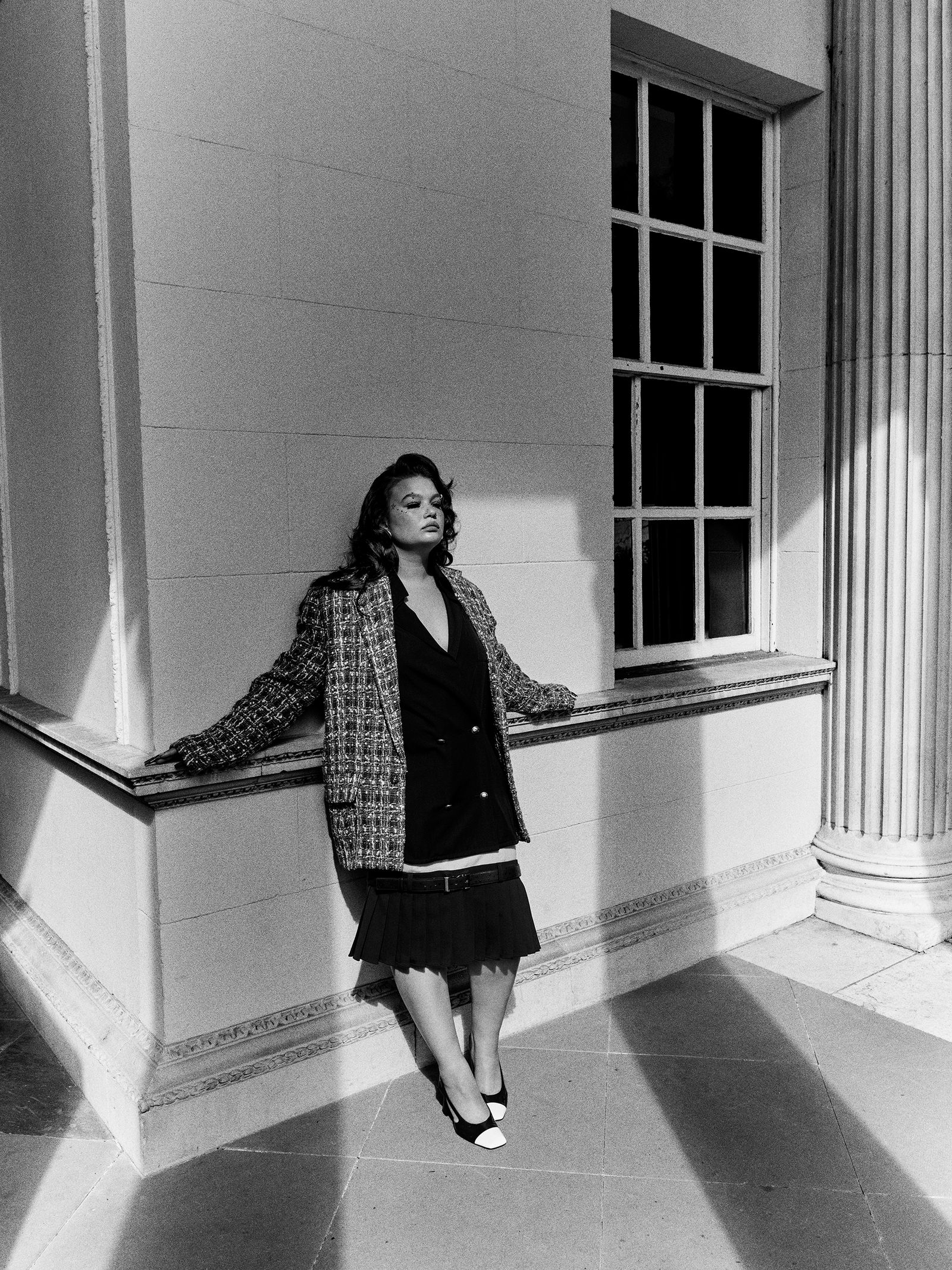 Lola Young Vogue architectural portrait Lola Young in a contextual photograph: Inline contextual photo; not tattoo evidence; not tattoo evidence