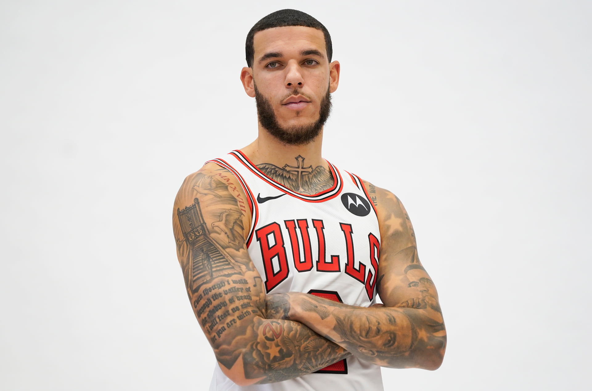 Lonzo Ball tattoos: Bulls portrait showing the civil-rights portrait work and full arms