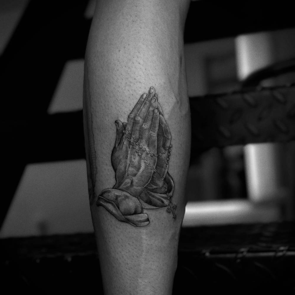 Romeo Beckham praying hands forearm tattoo