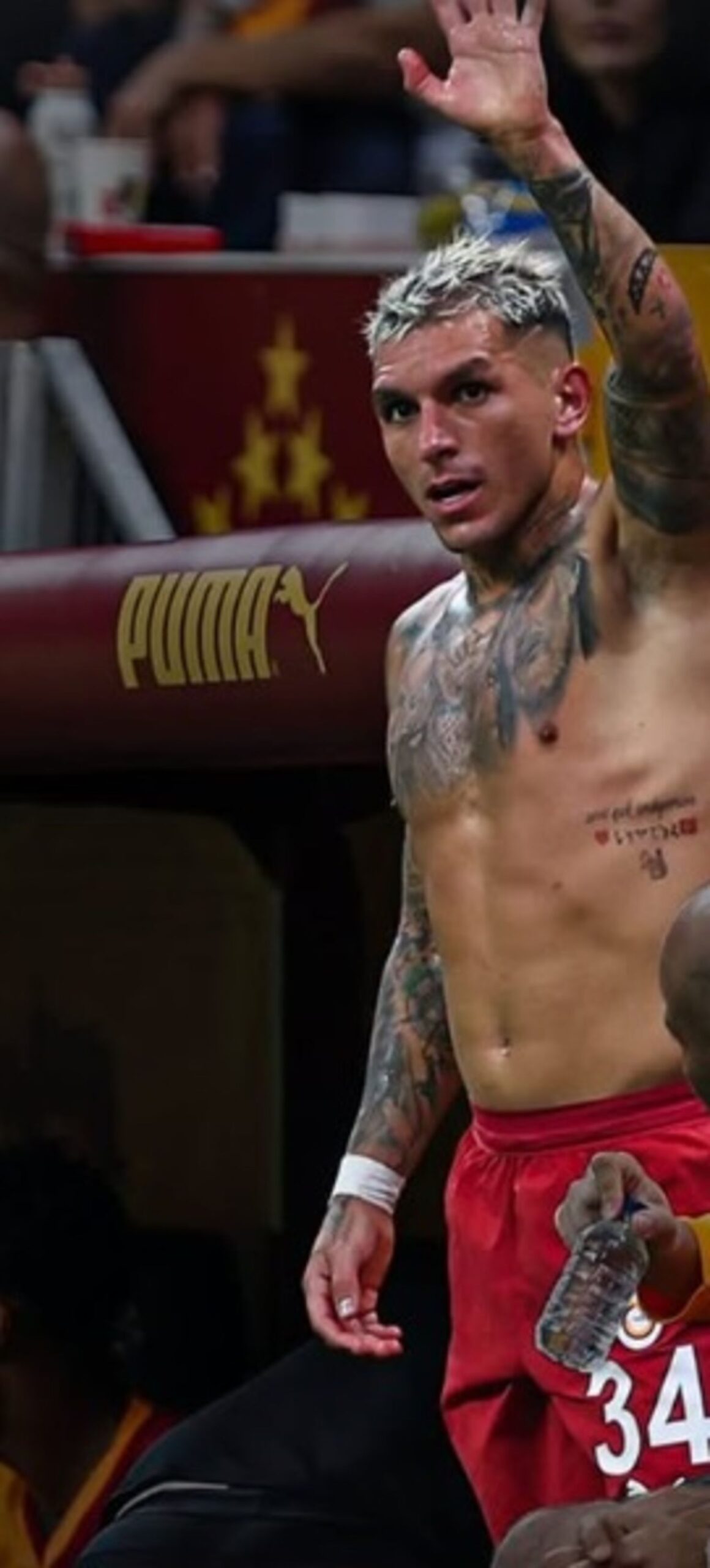 Lucas Torreira arm and chest tattoos Lucas Torreira tattoos: Genuine tattoo photograph showing Torreira’s visible arm and chest collection in a football setting.