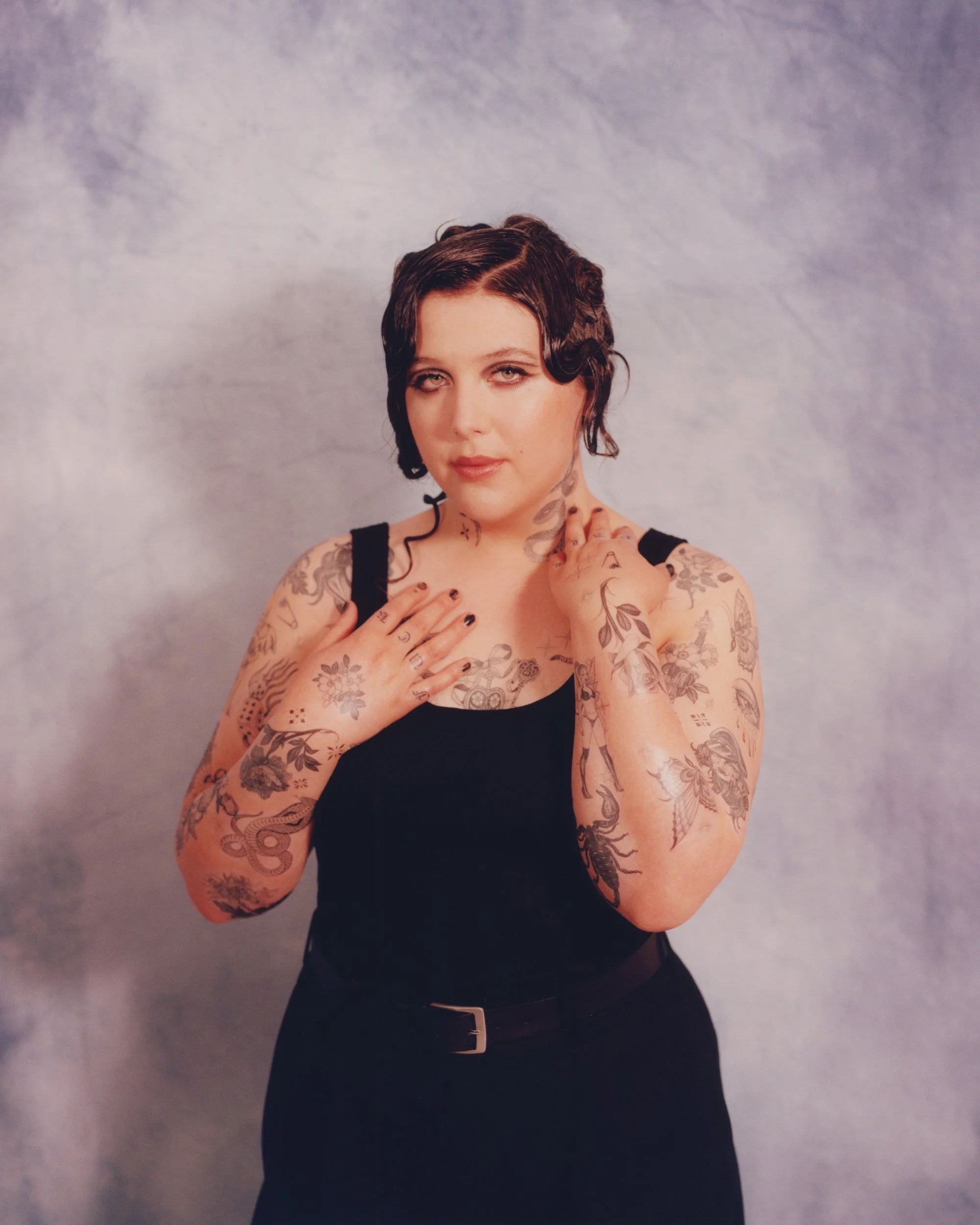 Lucy Dacus tattoos across both arms Lucy Dacus tattoos: inline