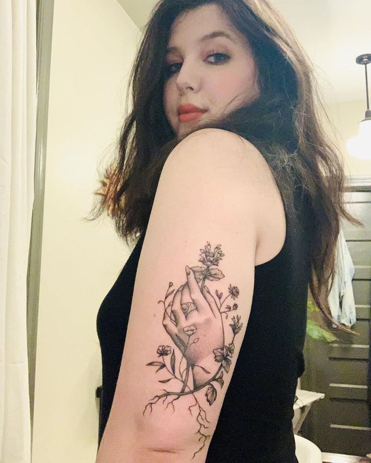 Lucy Dacus floral hand and forearm tattoo Lucy Dacus tattoos: inline
