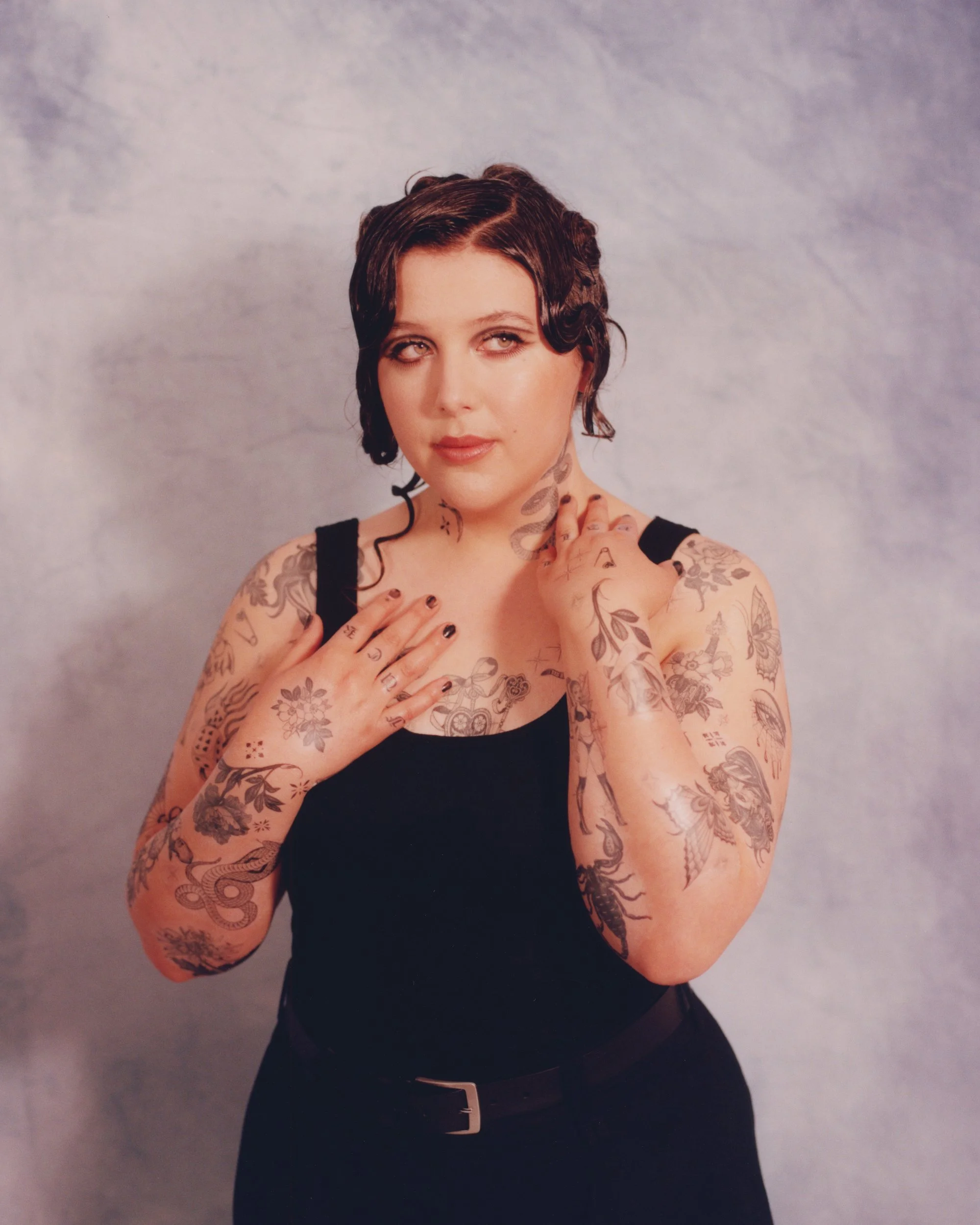 Lucy Dacus full floral and snake tattoo collection Lucy Dacus tattoos: inline