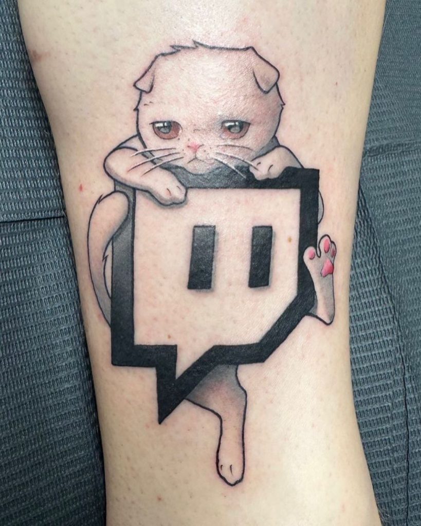 Ludwig Ahgren tattoos: The Coots and Twitch logo tattoo on his leg