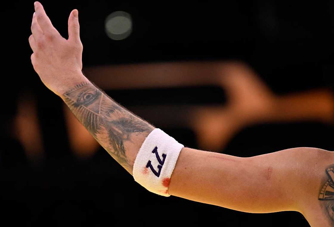 Luka Doncic tattoos: tiger and Eye of Providence forearm tattoo
