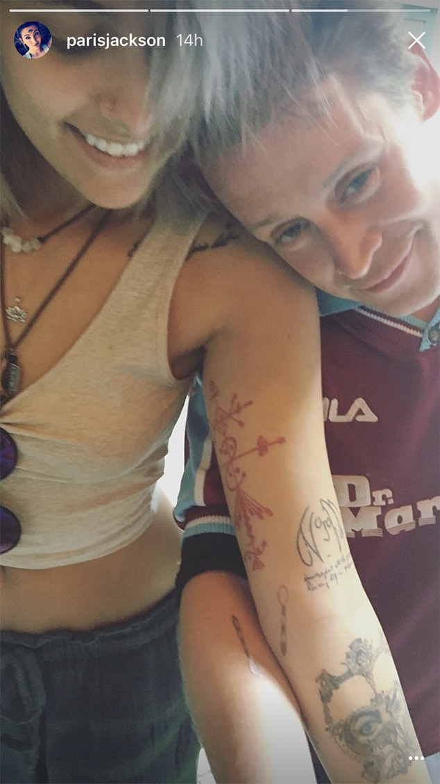 Macaulay Culkin and Paris Jackson with their matching spoon tattoos visible on their forearms