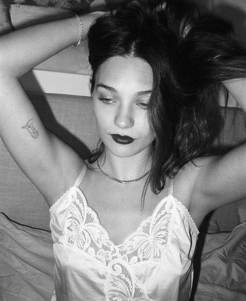 Maddie Ziegler with a small fine-line tattoo visible on her upper inner arm.