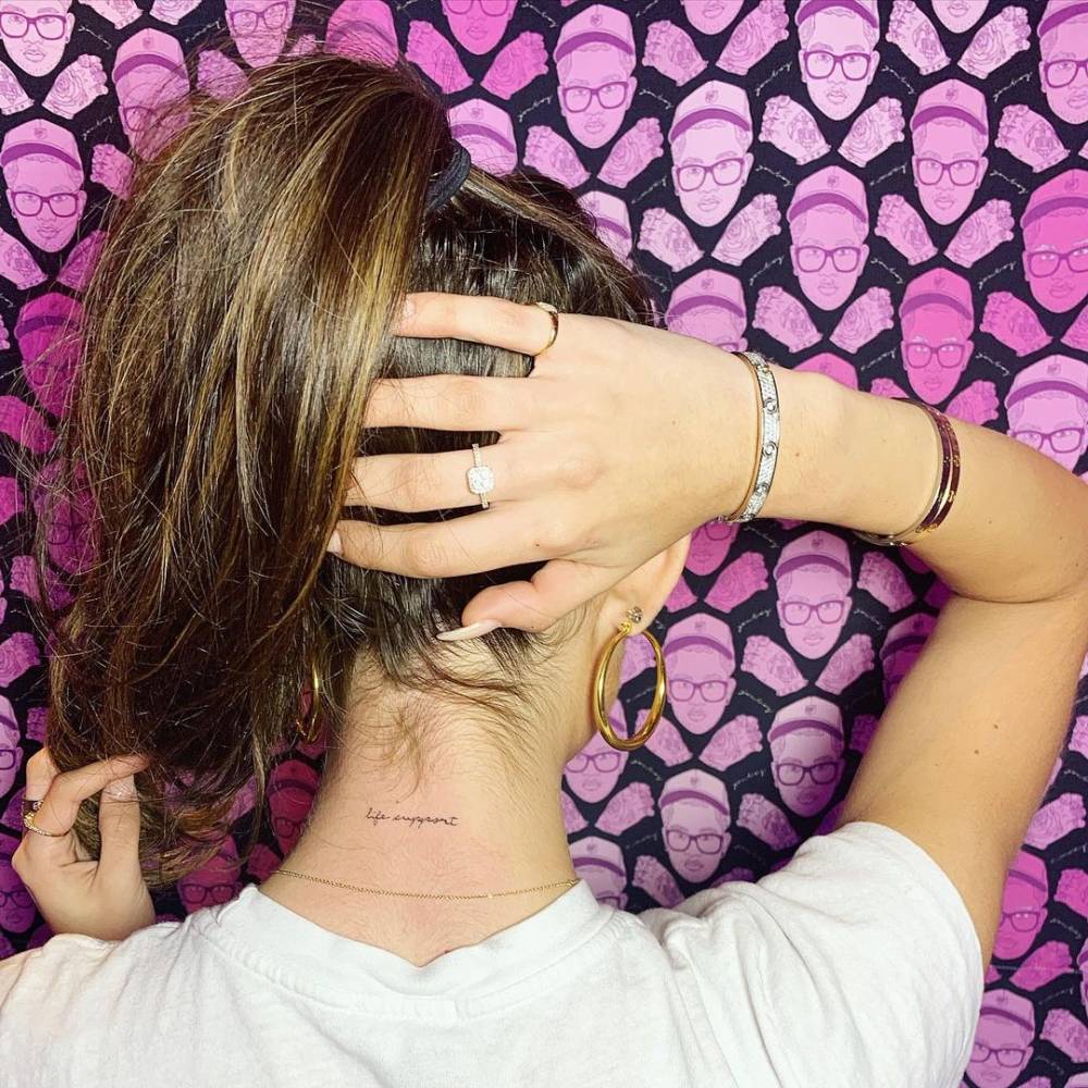 Madison Beer tattoos: Genuine close view of the nape lettering discussed in this tattoo-specific section.