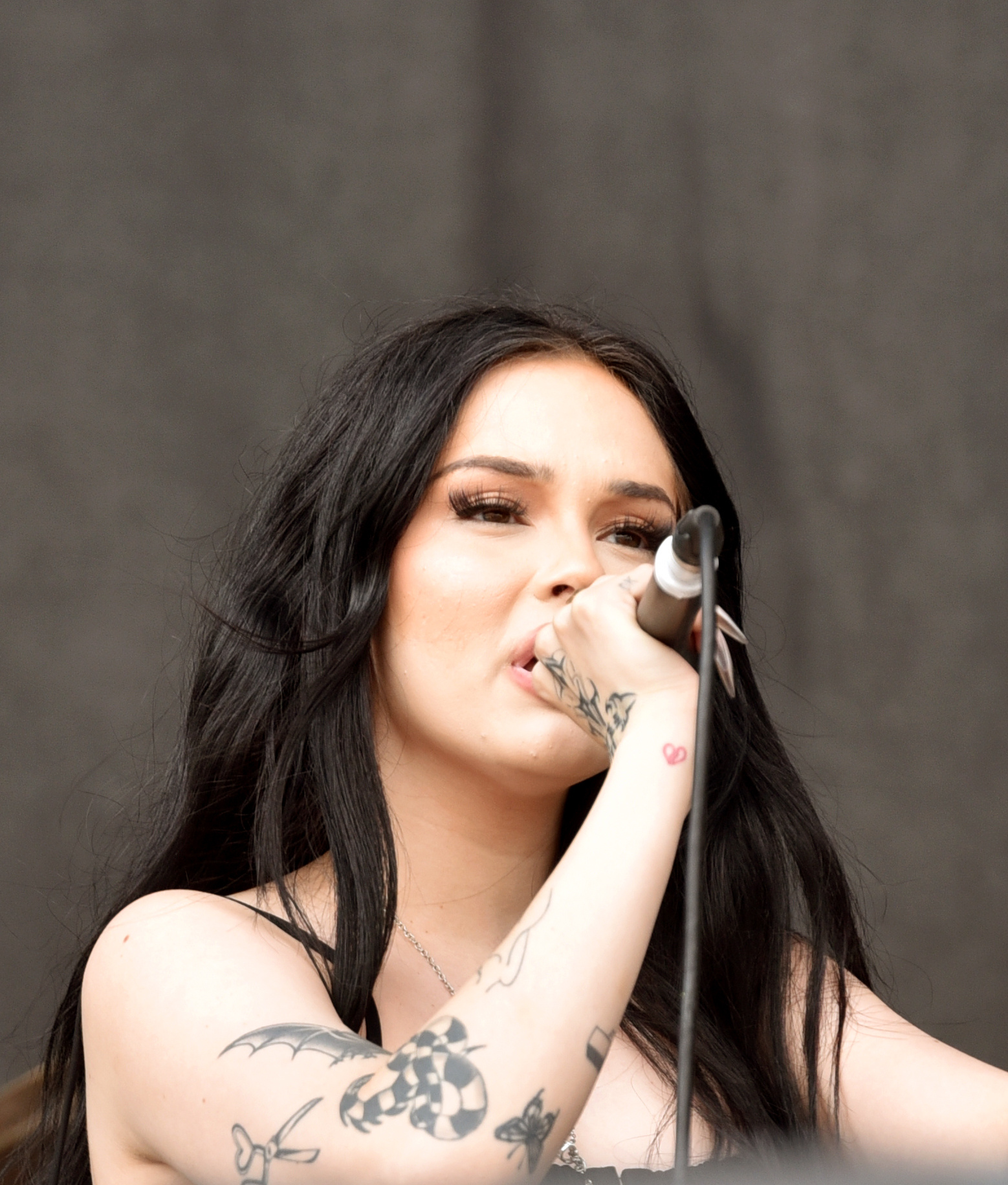 Maggie Lindemann arm tattoo closeup with visible ink