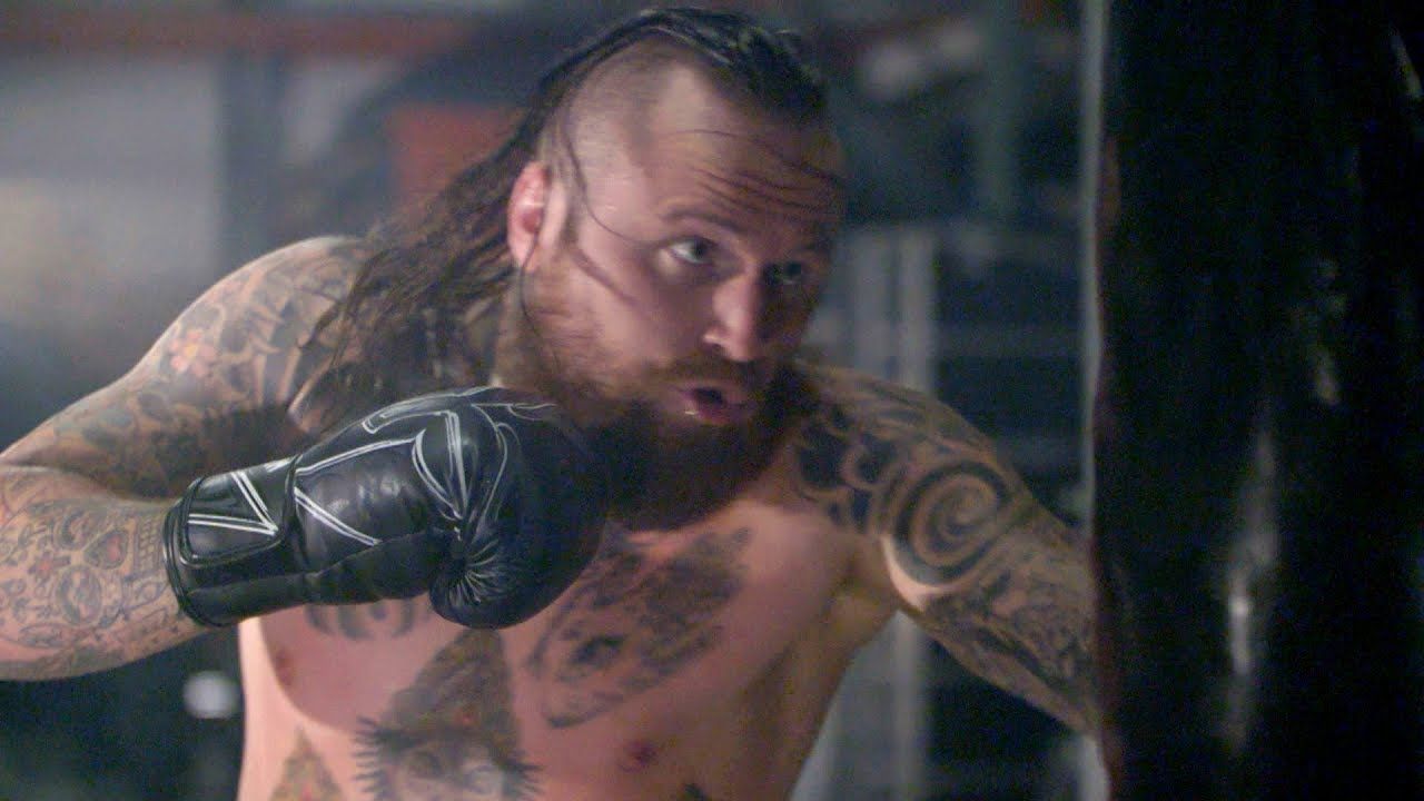 Malakai Black chest and arm tattoos in the ring