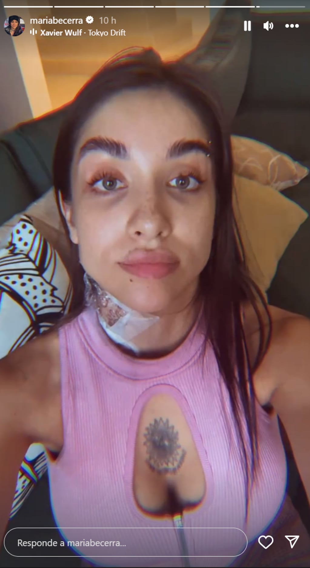 María Becerra tattoos: documented new-tattoo story frame showing the fresh chest and neck reveal