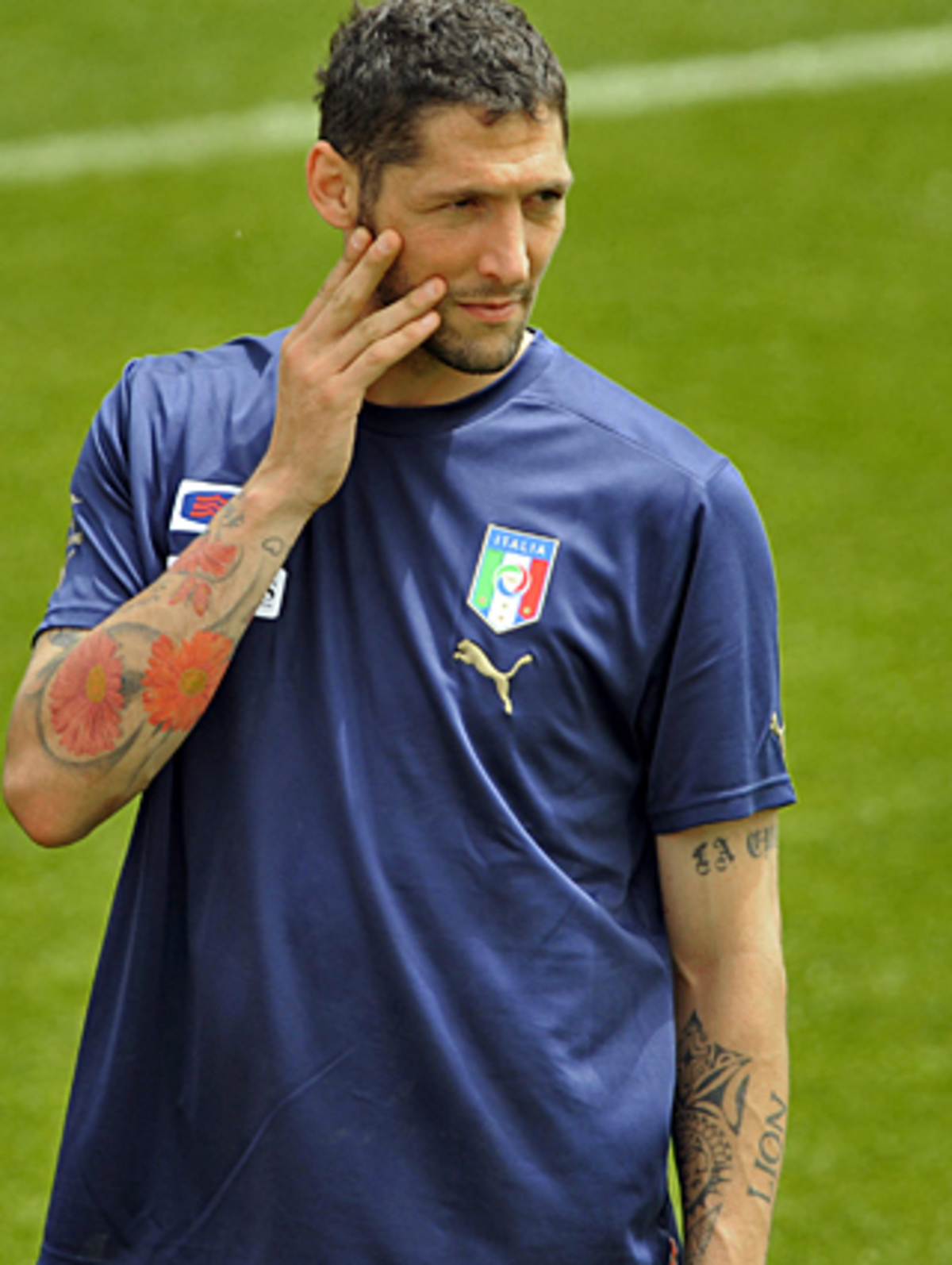 Marco Materazzi tattoos: Close training view of the colorful forearm work