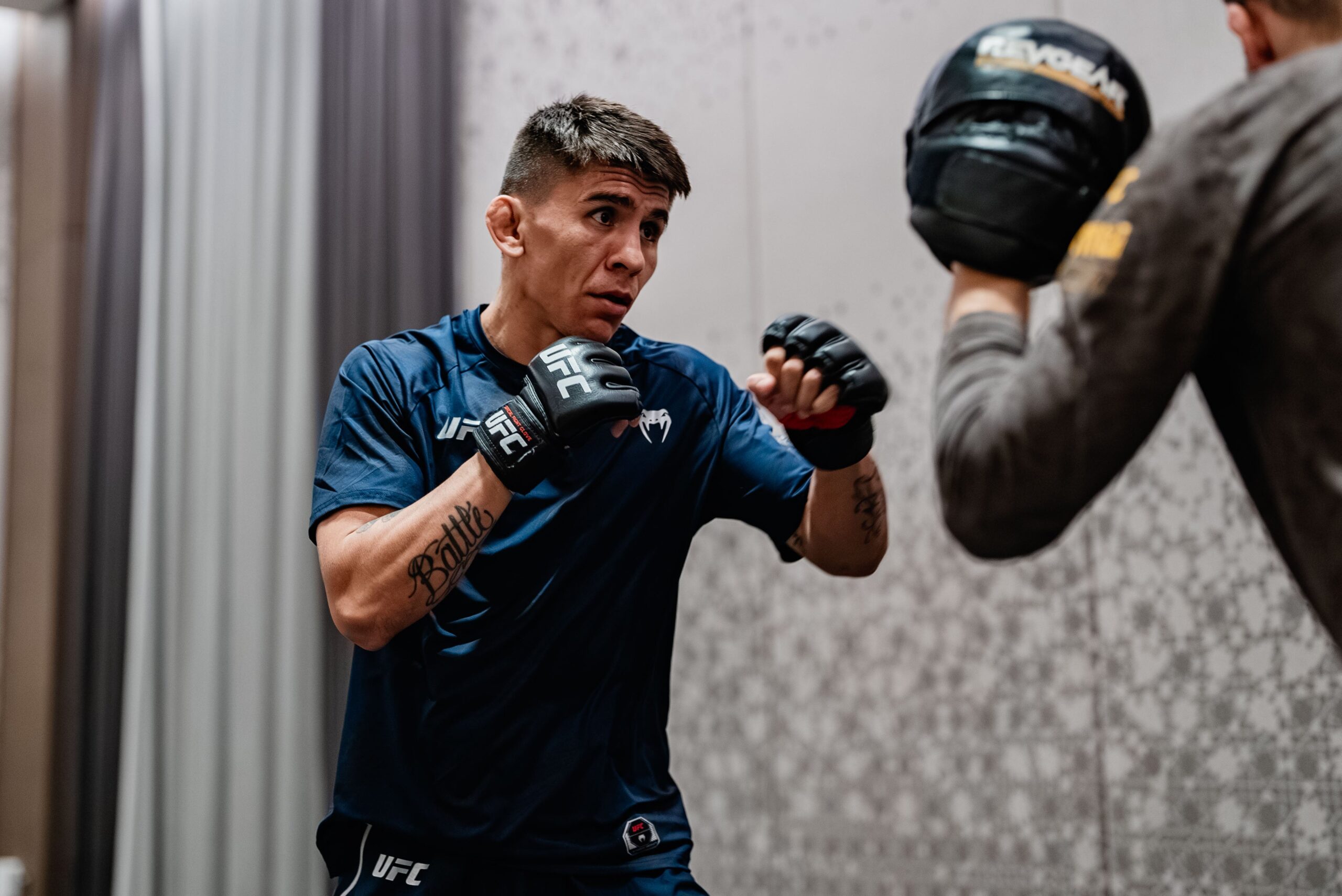 Mario Bautista in a contextual photograph: Training at The MMA Lab; not tattoo evidence