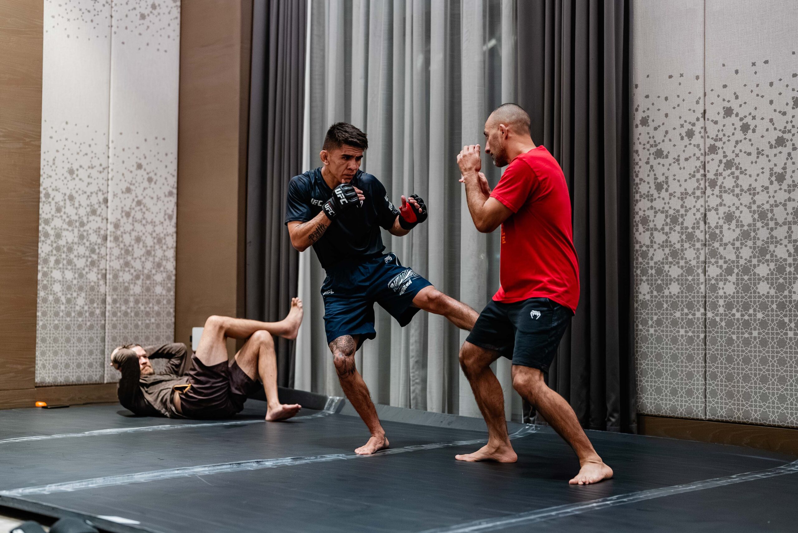 Mario Bautista in a contextual photograph: Work on the mats; not tattoo evidence