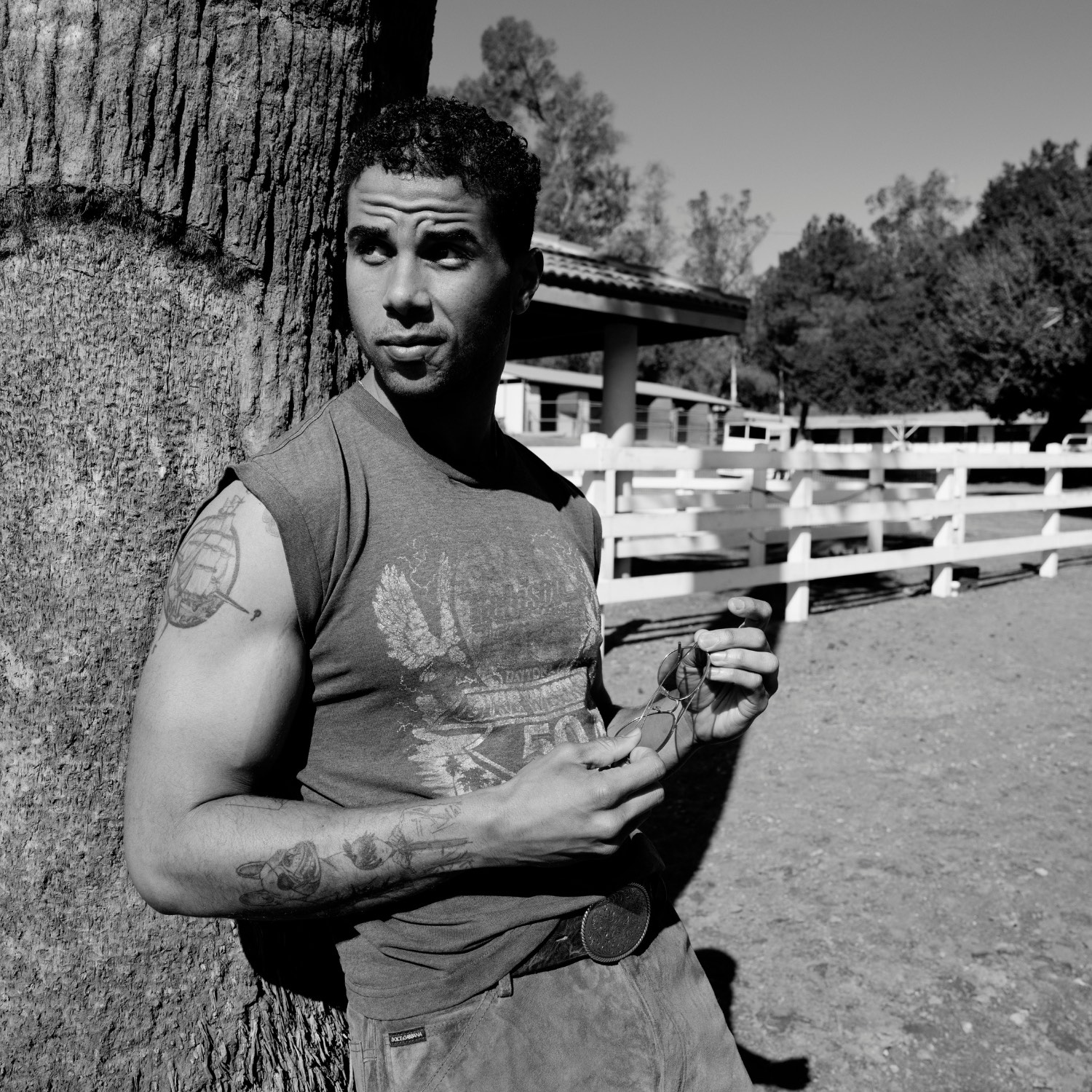 Mason Gooding tattoos: Genuine editorial tattoo photograph showing the illustrated arm and forearm pieces in a separate outdoor portrait.