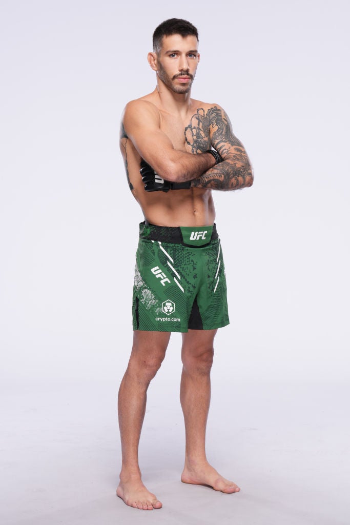 Matheus Nicolau in a contextual photograph: A full-length studio view; not tattoo evidence