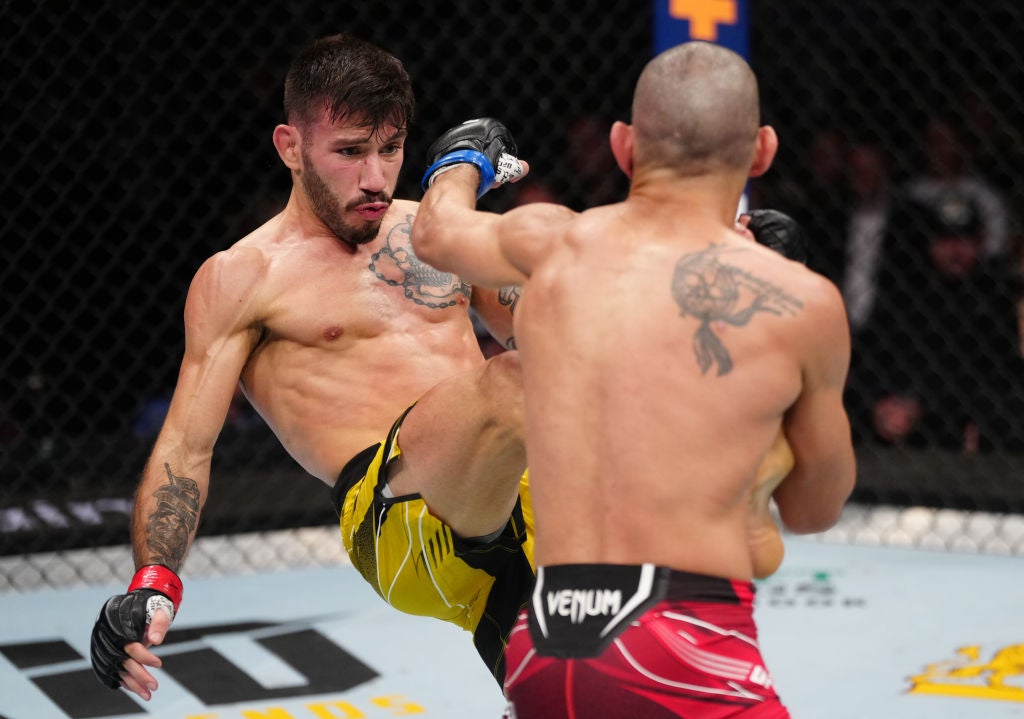 Matheus Nicolau tattoos: The helmeted figure on his right forearm