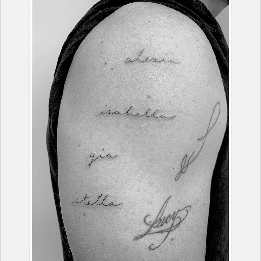 Matt Damon tattoos: Matt Damon's family lettering and Lucy tattoo close-up