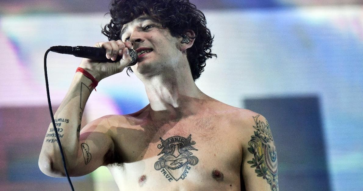 Matty Healy TRUE LOVE chest tattoo and arm tattoos