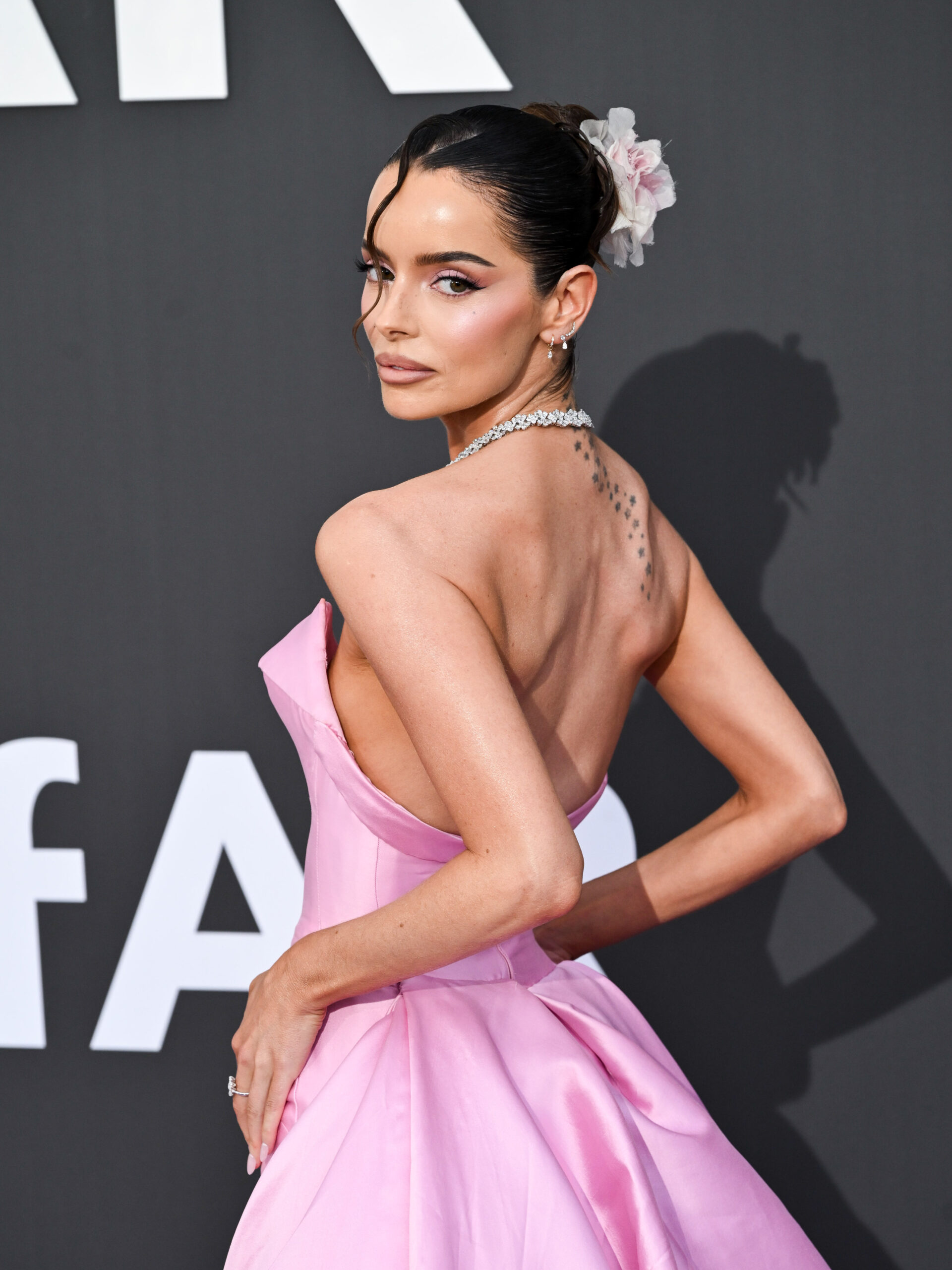 Maura Higgins in a pink strapless gown Maura Higgins in a contextual photograph: contextual portrait, not tattoo evidence; not tattoo evidence