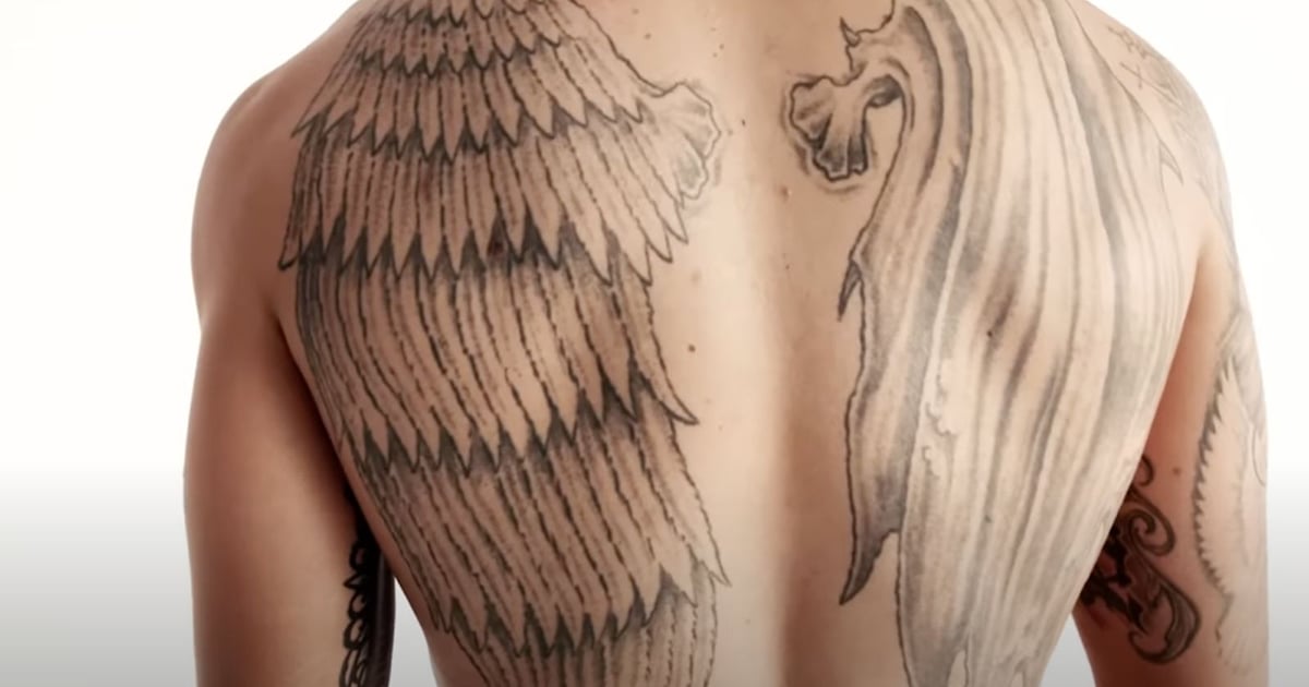 Max Holloway Angel and Gargoyle Back Wings Tattoo Max Holloway tattoos: Angel and gargoyle wings spanning the back, illustrating the balance he described