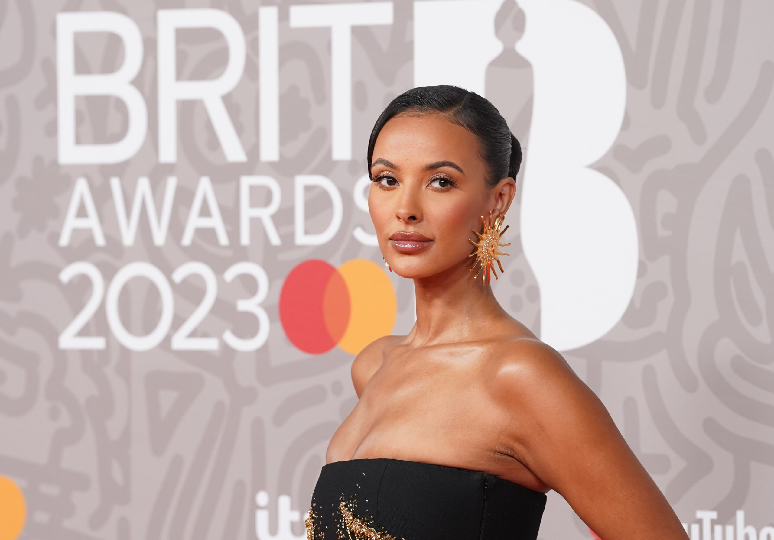 Maya Jama in a contextual photograph: inline; not tattoo evidence