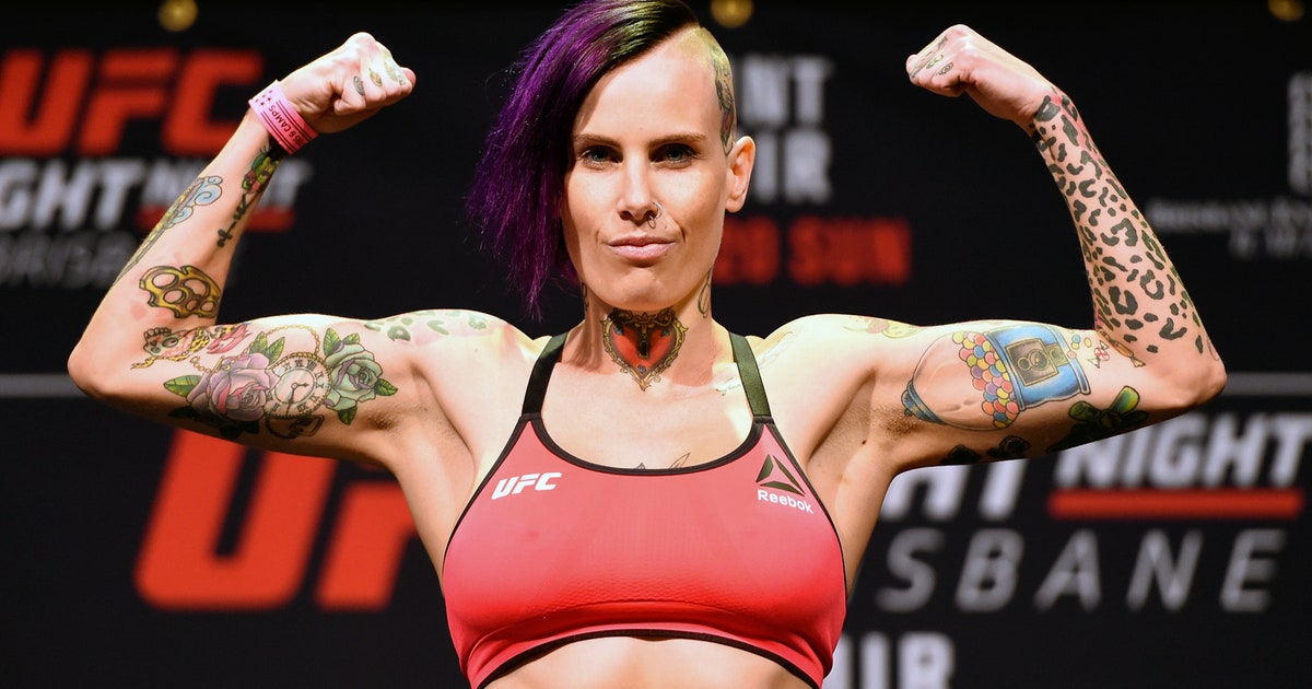 Megan Anderson tattoos: colorful weigh-in view showing the floral, leopard and chest pieces clearly