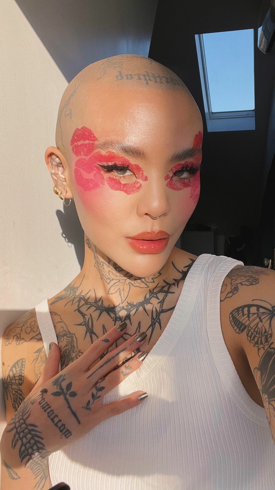 Mei Pang tattoos: close face and upper-chest tattoo evidence