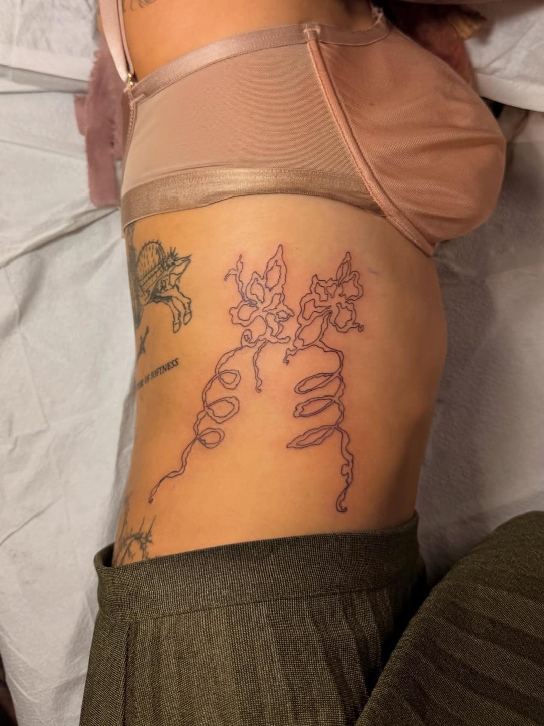 Melanie Martinez hip and side tattoo detail