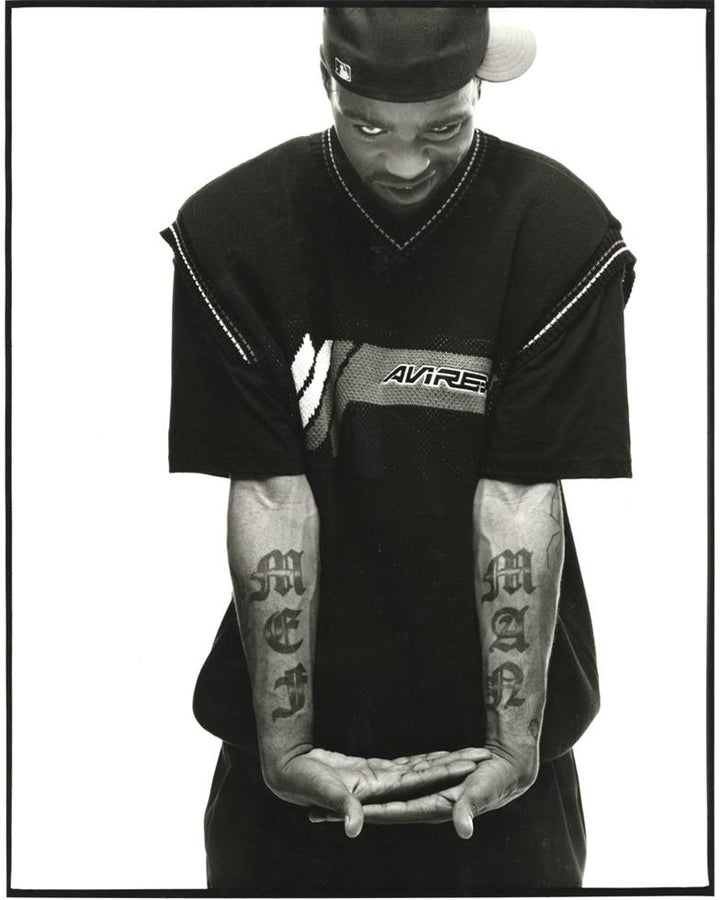 Method Man tattoos: archival portrait clearly showing the MEN and MAN forearm lettering