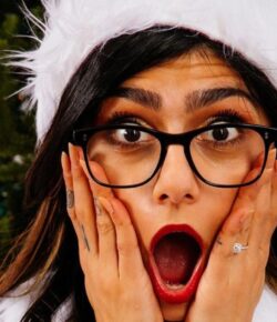 Mia Khalifa Tattoos: Her Arabic Script, Cross and Hand Ink
