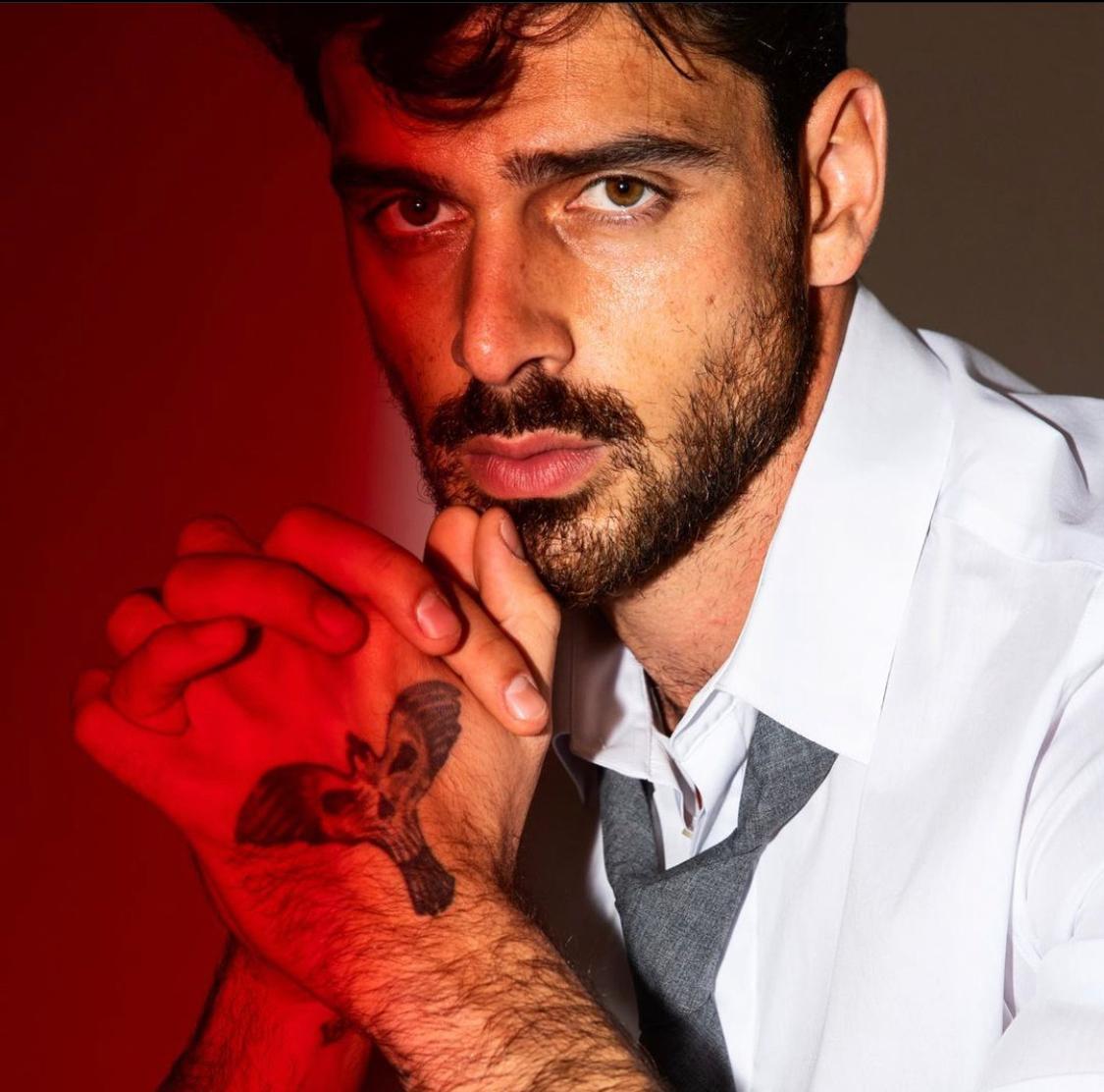 Michele Morrone tattoos: Shows the hand design discussed in the hand-ink section.