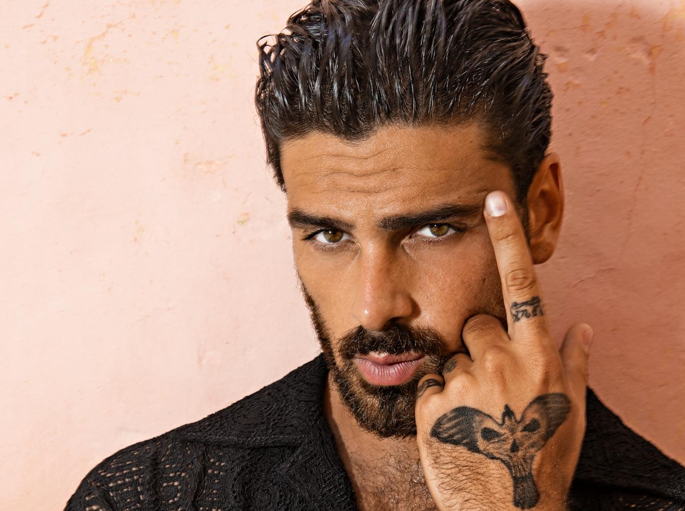 Michele Morrone tattoos: A distinct close view of his hand ink, used with the hand tattoo discussion.